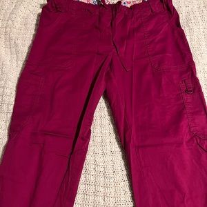 Maroon scrub pants.